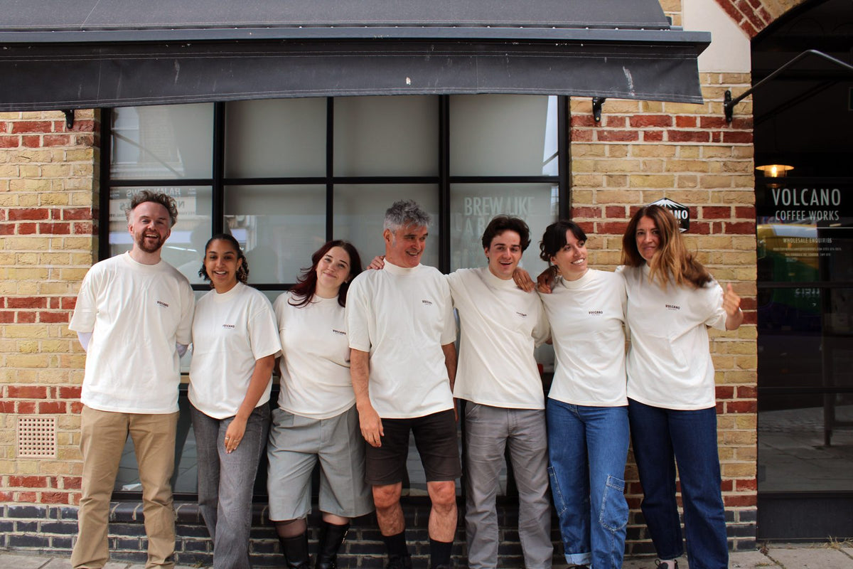 The Volcano Coffee Works team in matching T-shirts outside their building in South London